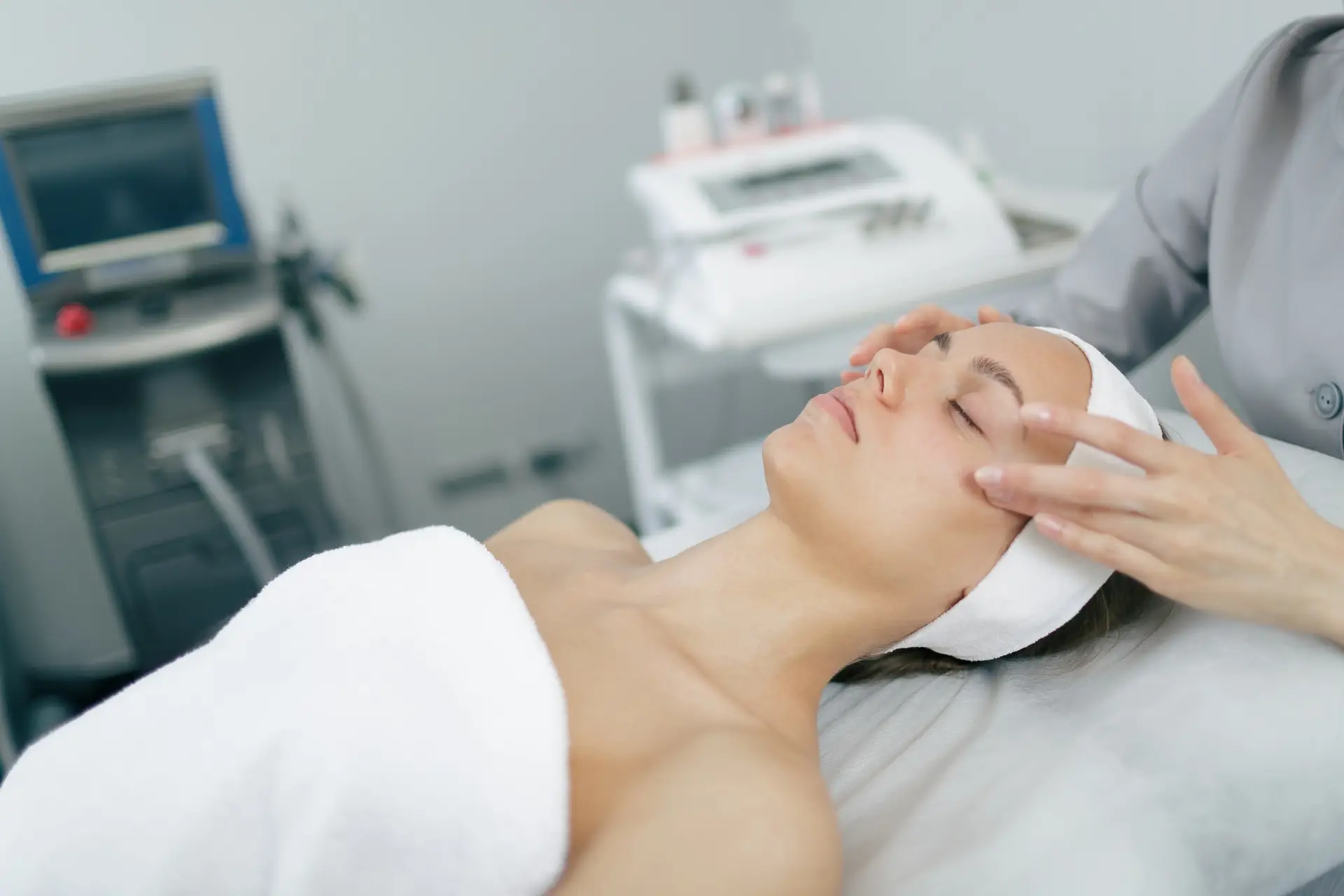 Facial massage session for rejuvenation and skincare in modern beauty clinic.