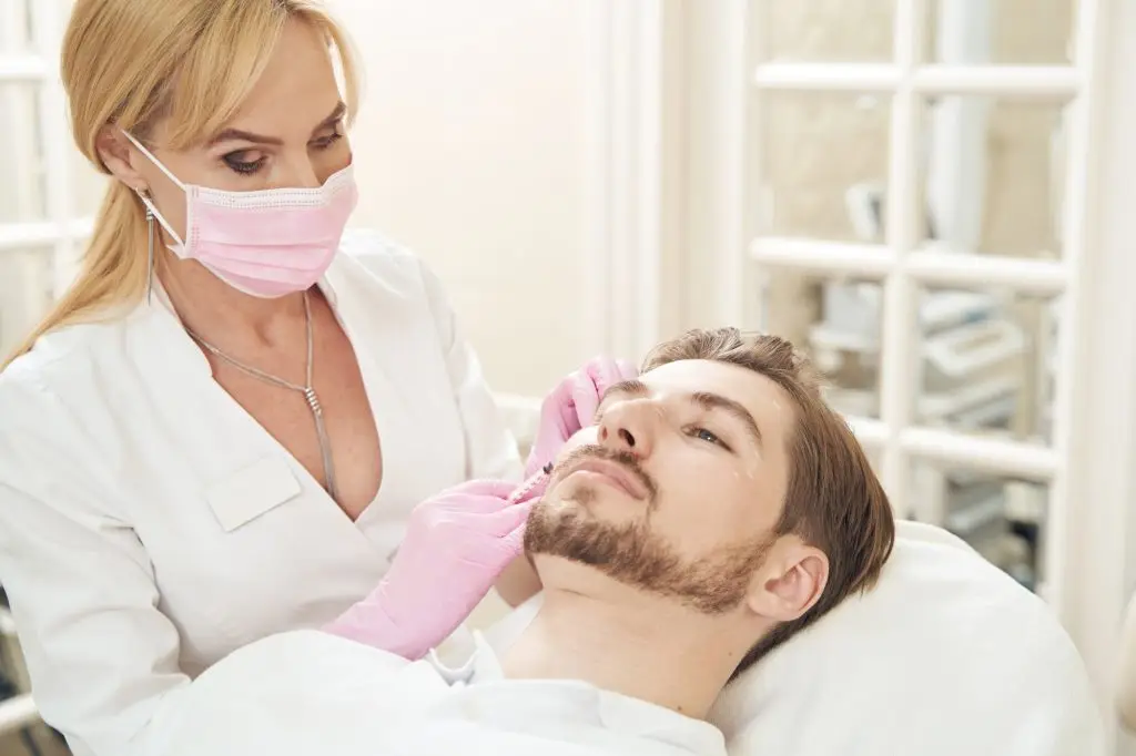 Collected patient experiencing botox treatment in beauty clinic