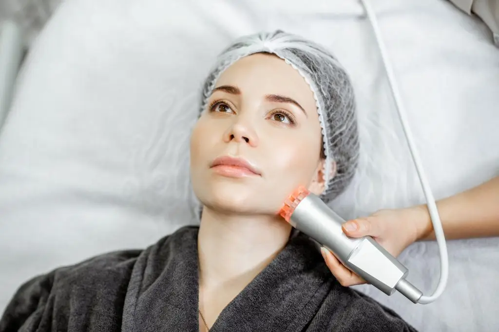 Woman during the facial treatment at the beauty salon