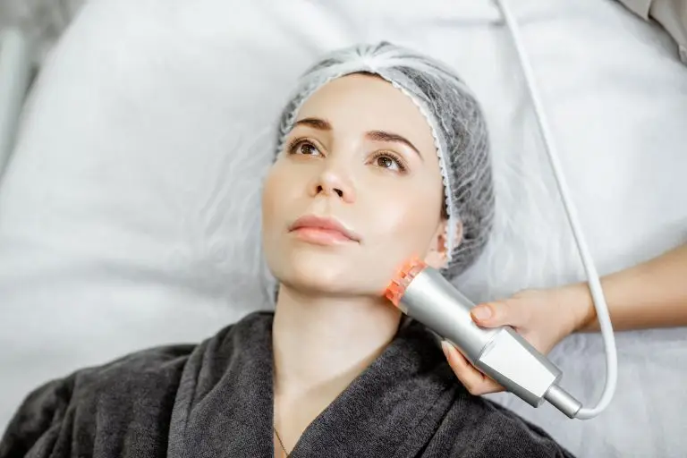 Woman during the facial treatment at the beauty salon